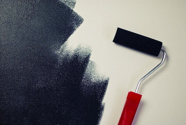 Paint roller on the wall